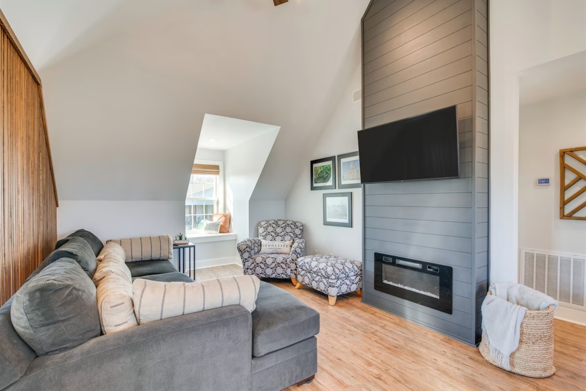 Living area with ceiling fans and smart TV