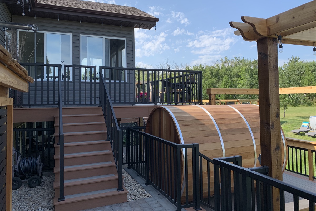 STAIRS TO GUEST ENTRANCE. 3 WAY LIGHT SWITCH FOR COURT YARD ON WOOD POST TO RIGHT.