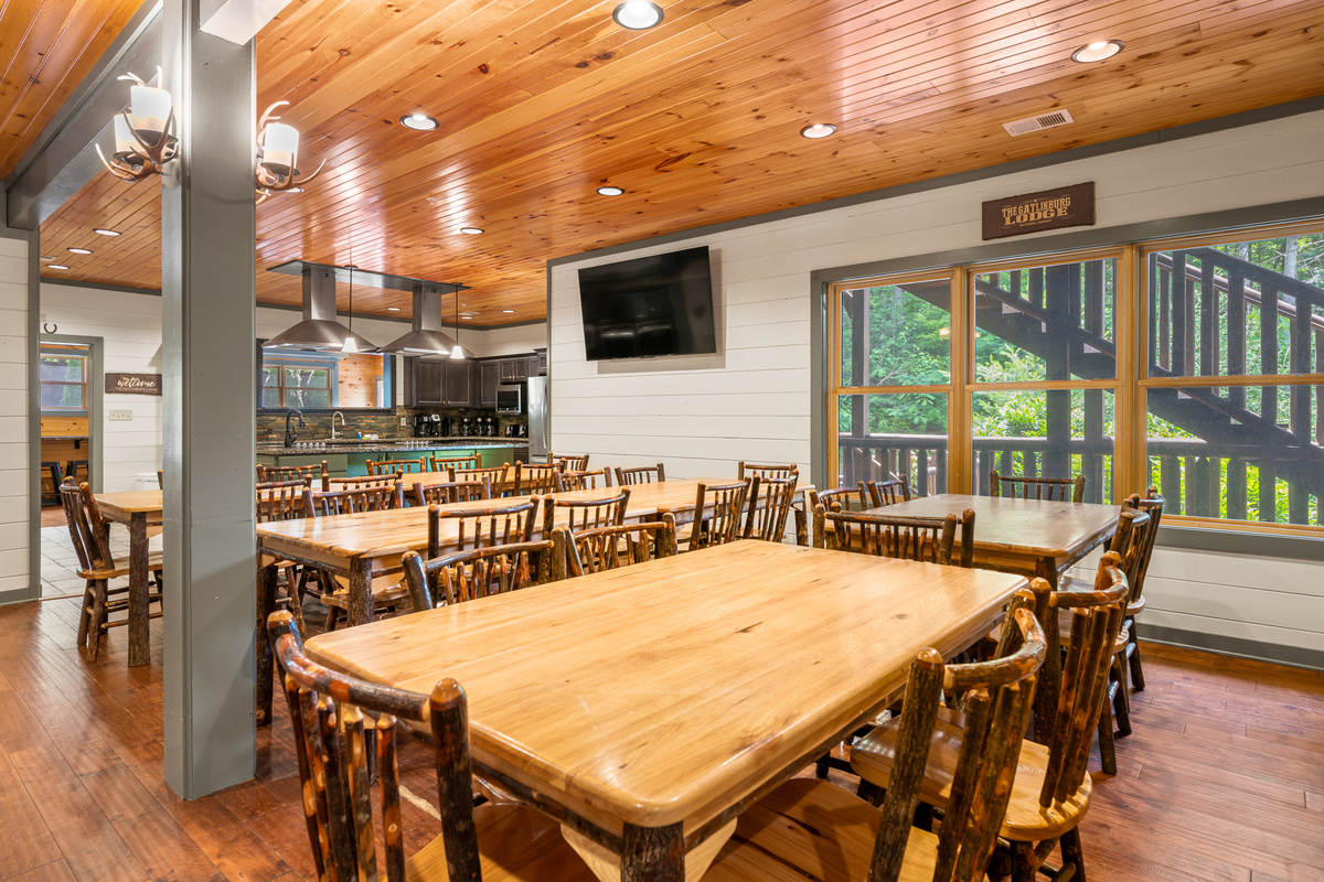 Grand Dining Hall -Solid wood tables that seat all 64+ guests at once. Set for a family-style meal, a group dinner, or a morning devotional. No restaurant reservations, no splitting up — everyone eats together.