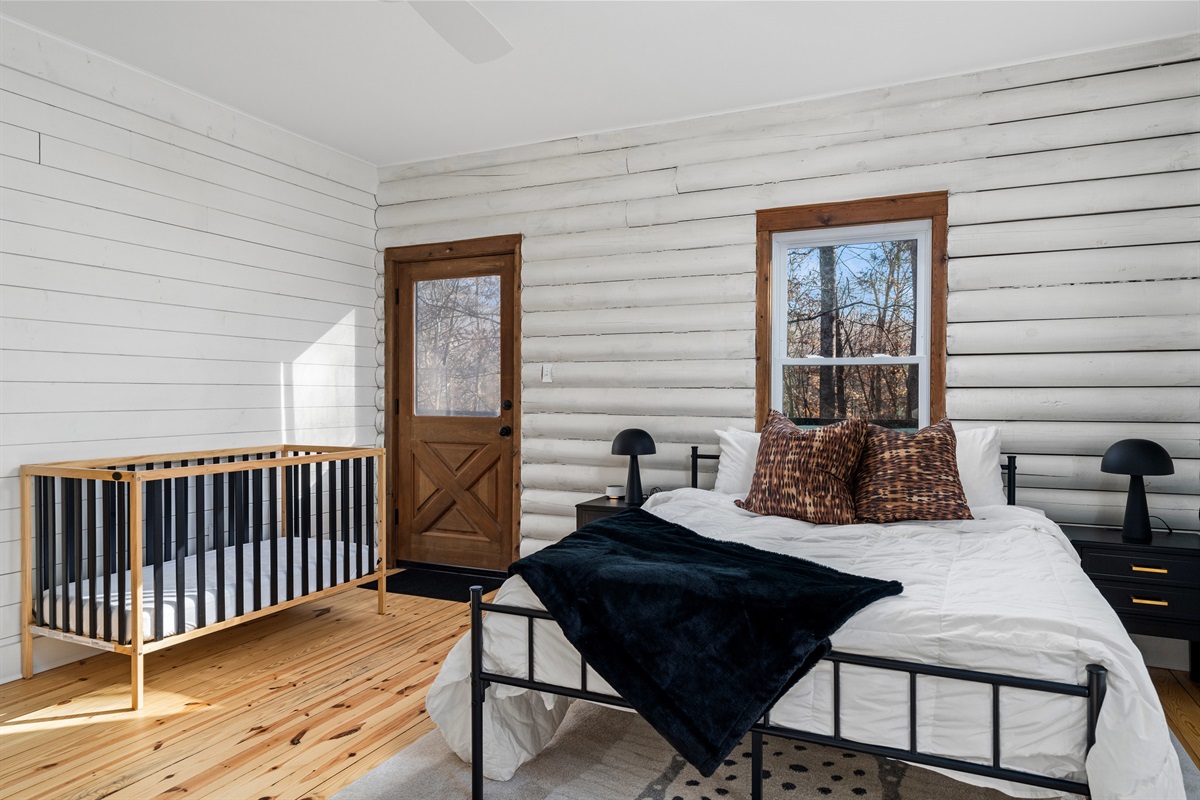 Bedroom 2: Sunlight spills through windows, highlighting rustic charm and modern comfort!