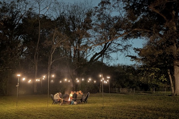 String lights, a cozy fire, and room for everyone to gather.