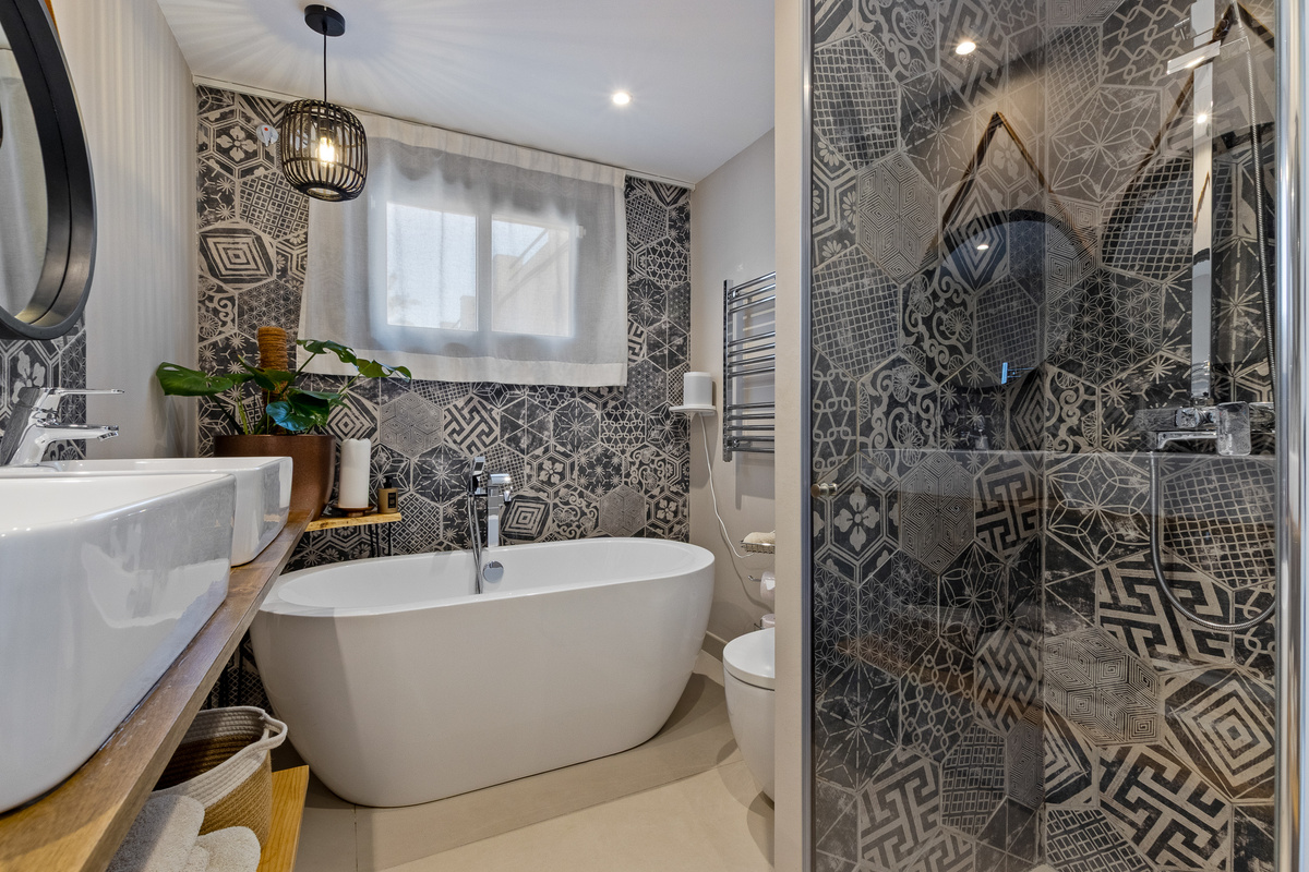 Spacious bathroom with freestanding tub and walk-in shower