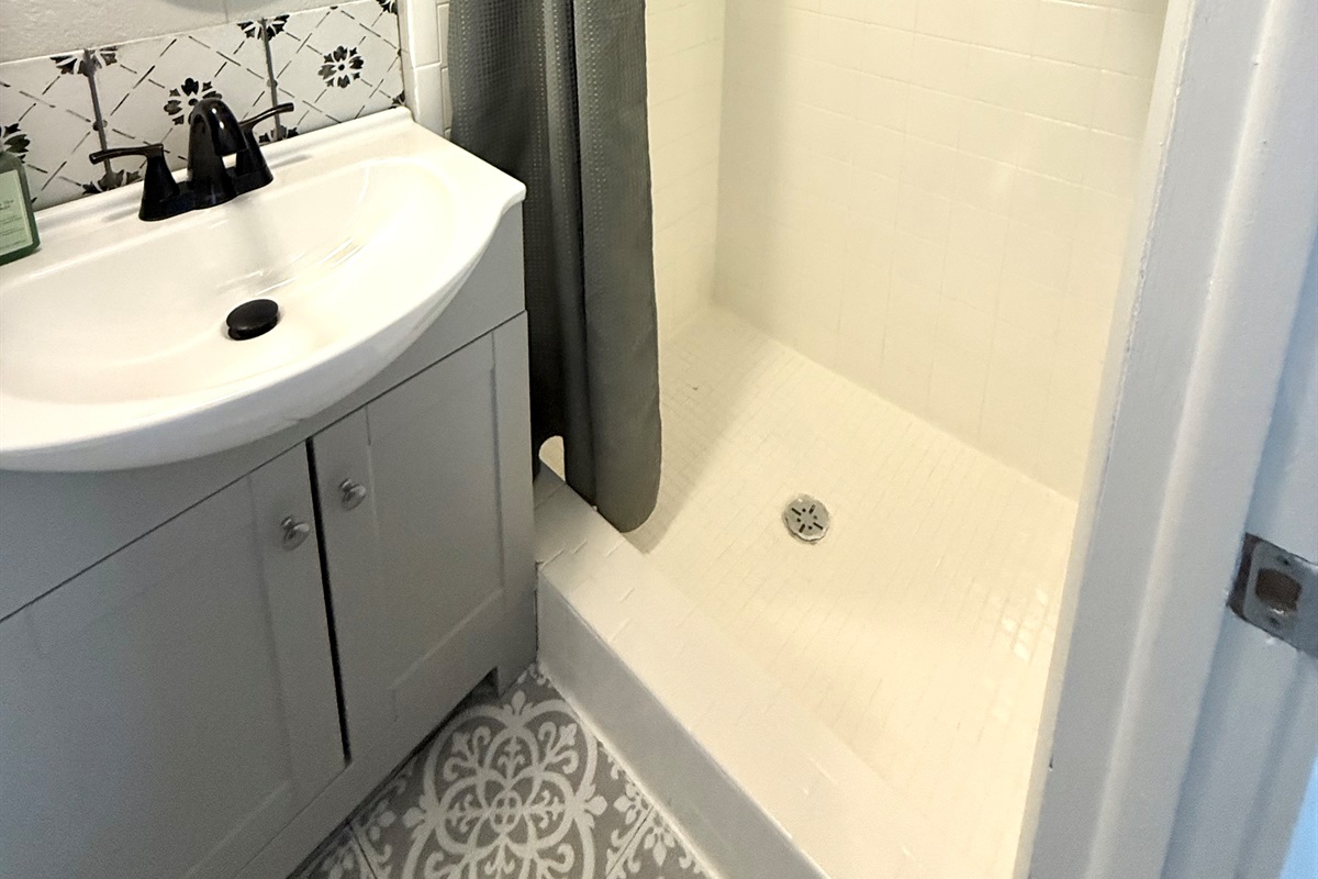 Bathroom with walk in shower.