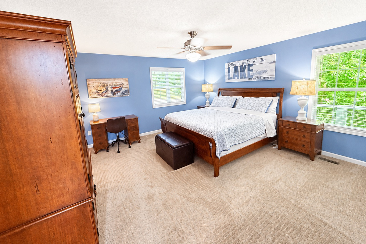 Bright master bedroom with cozy bedding