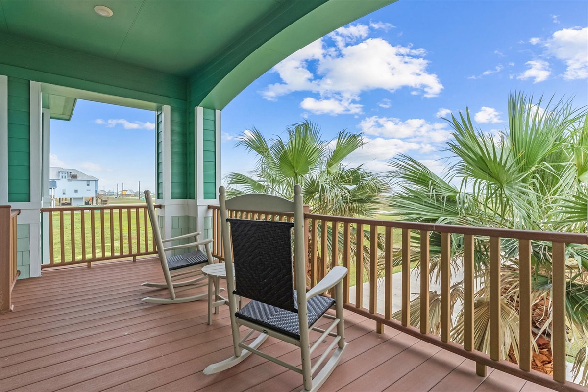 Front patio: Rocking chairs and serene views of the bay