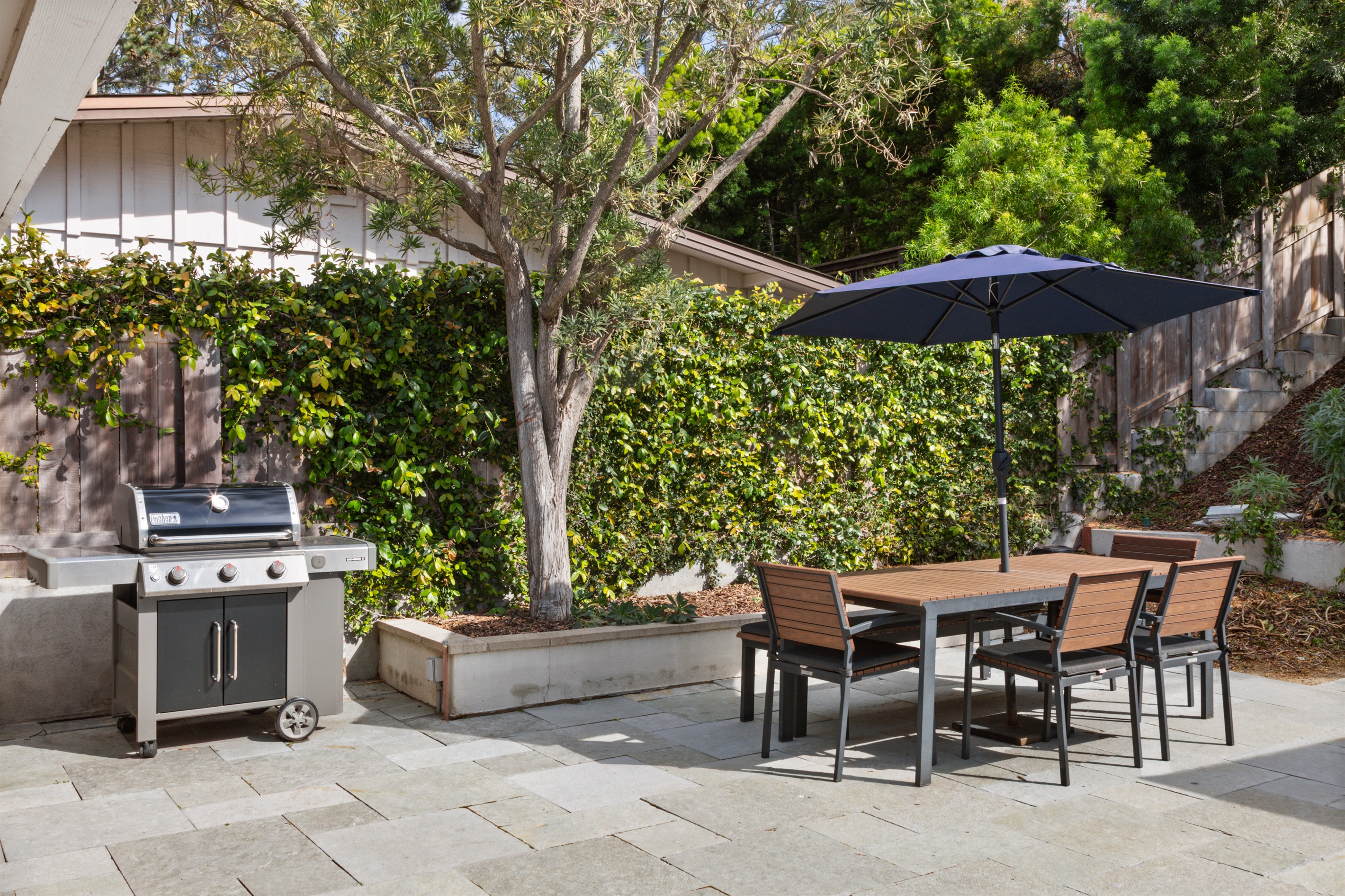 Grill and dine in your spacious back yard