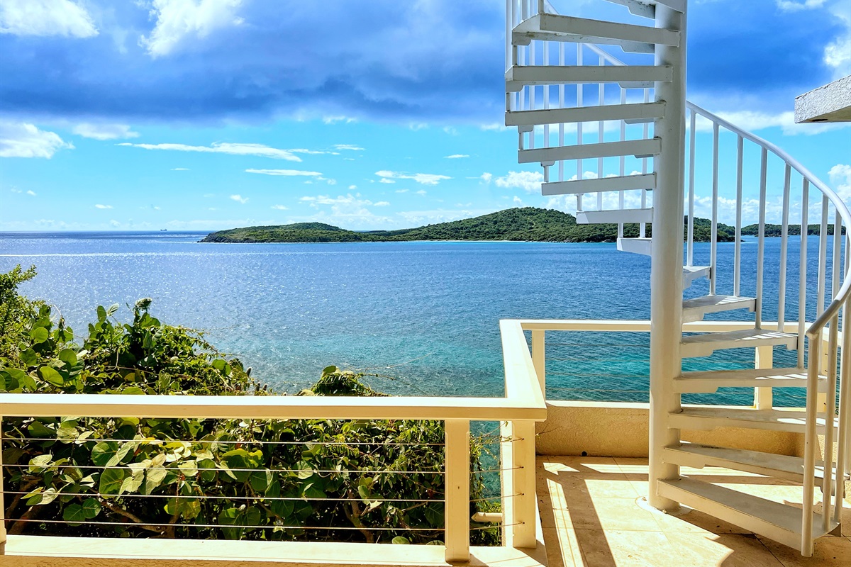 Spiral staircase that leads from the pool deck down to the lower level, for quick access.