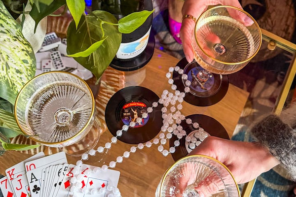Champagne, vintage glassware, and game night vibes in this stylish New Orleans Airbnb.  The perfect setting for celebrations, girls trips, and unforgettable weekends near the French Quarter. 