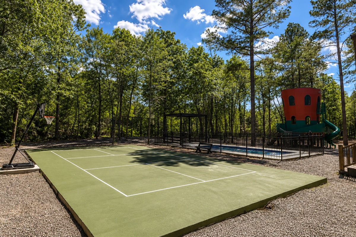 Outdoor Fun Zone: Enjoy games and laughter in a spacious yard with basketball and playground fun!