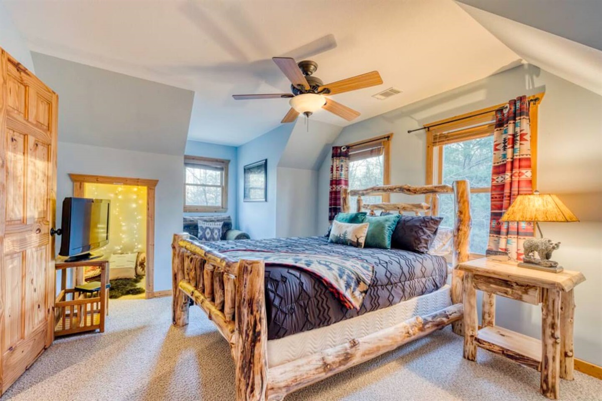 The upstairs bedroom is equipped with a TV for your entertainment.