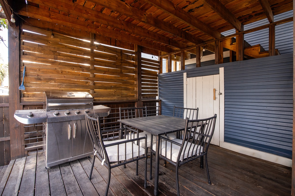 Elevate your balcony experience: plush chairs, a quaint table, and a touch of tranquility create the perfect outdoor escape