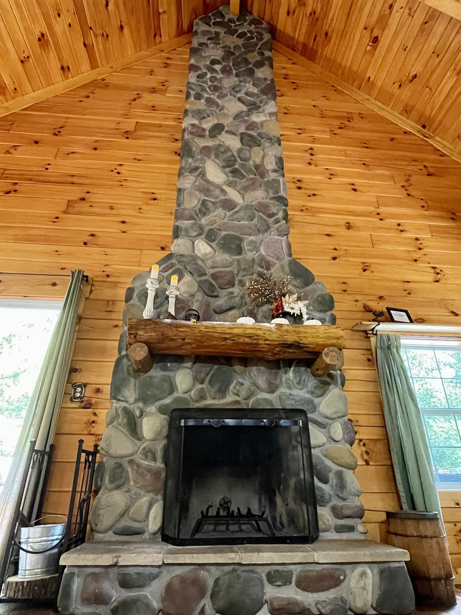 Floor to ceiling stone Fireplace