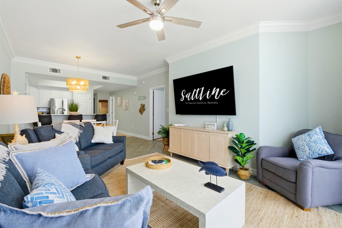 Warm coastal d&eacute;cor and sweeping water views create a space that feels both inviting and effortlessly relaxing.