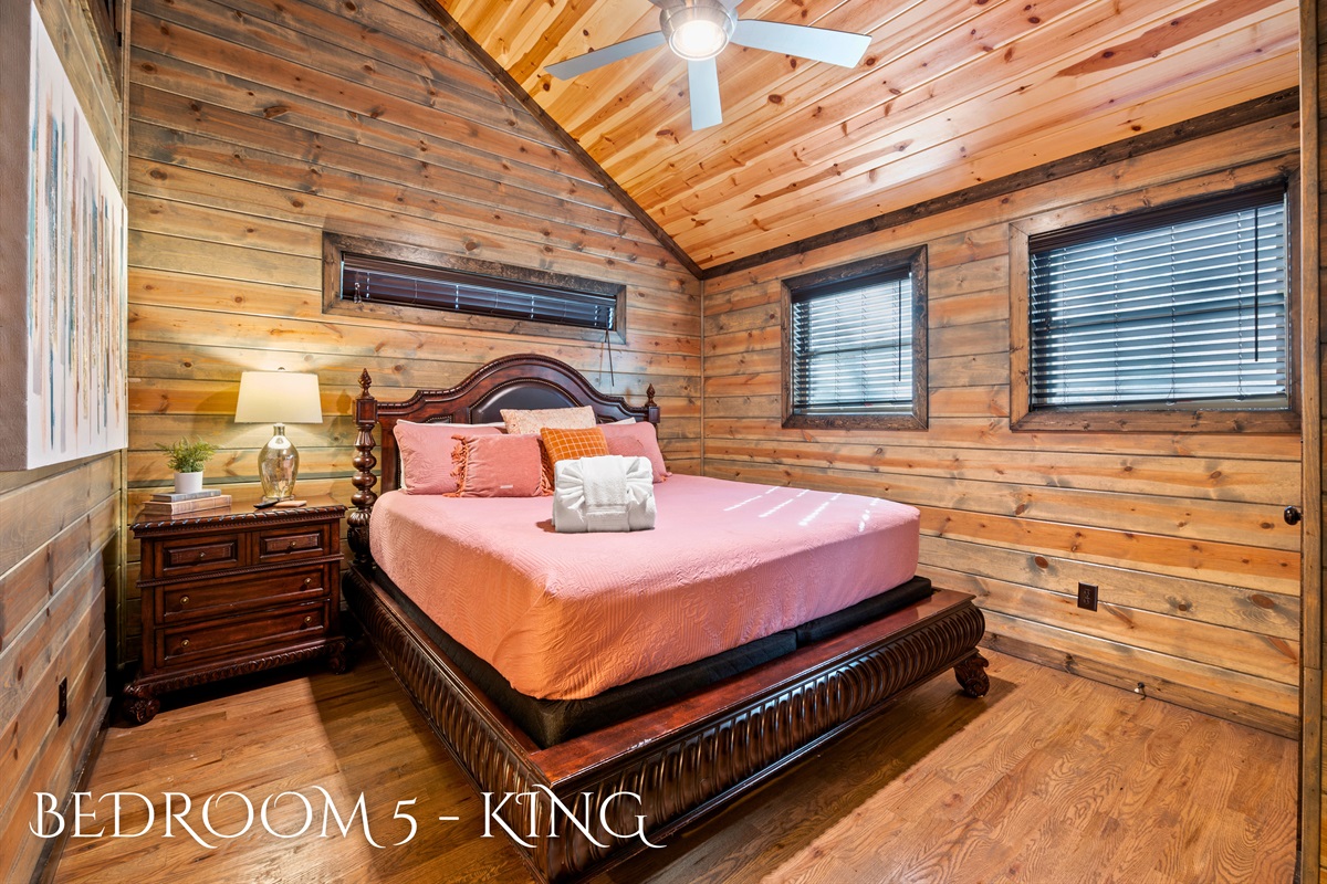 A colorful and inviting king size bed.