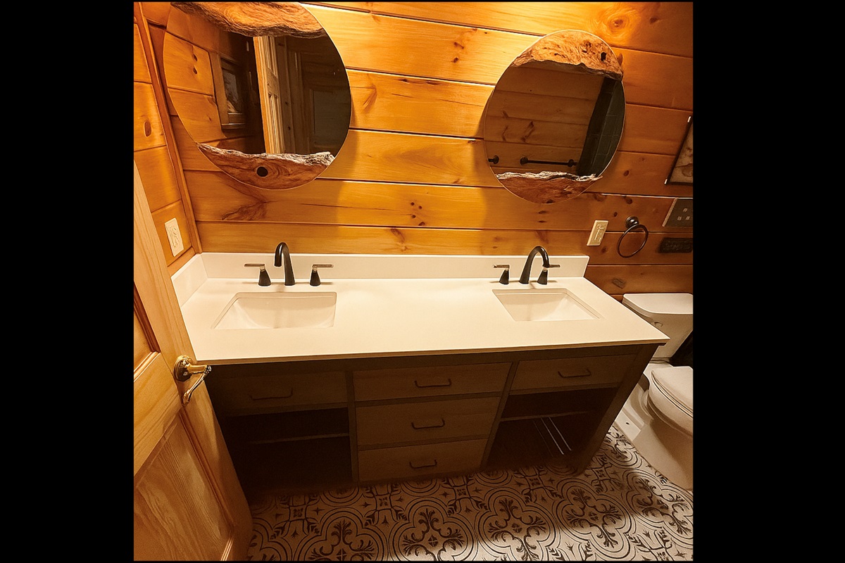 Double sink vanity in common bathroom on the main level