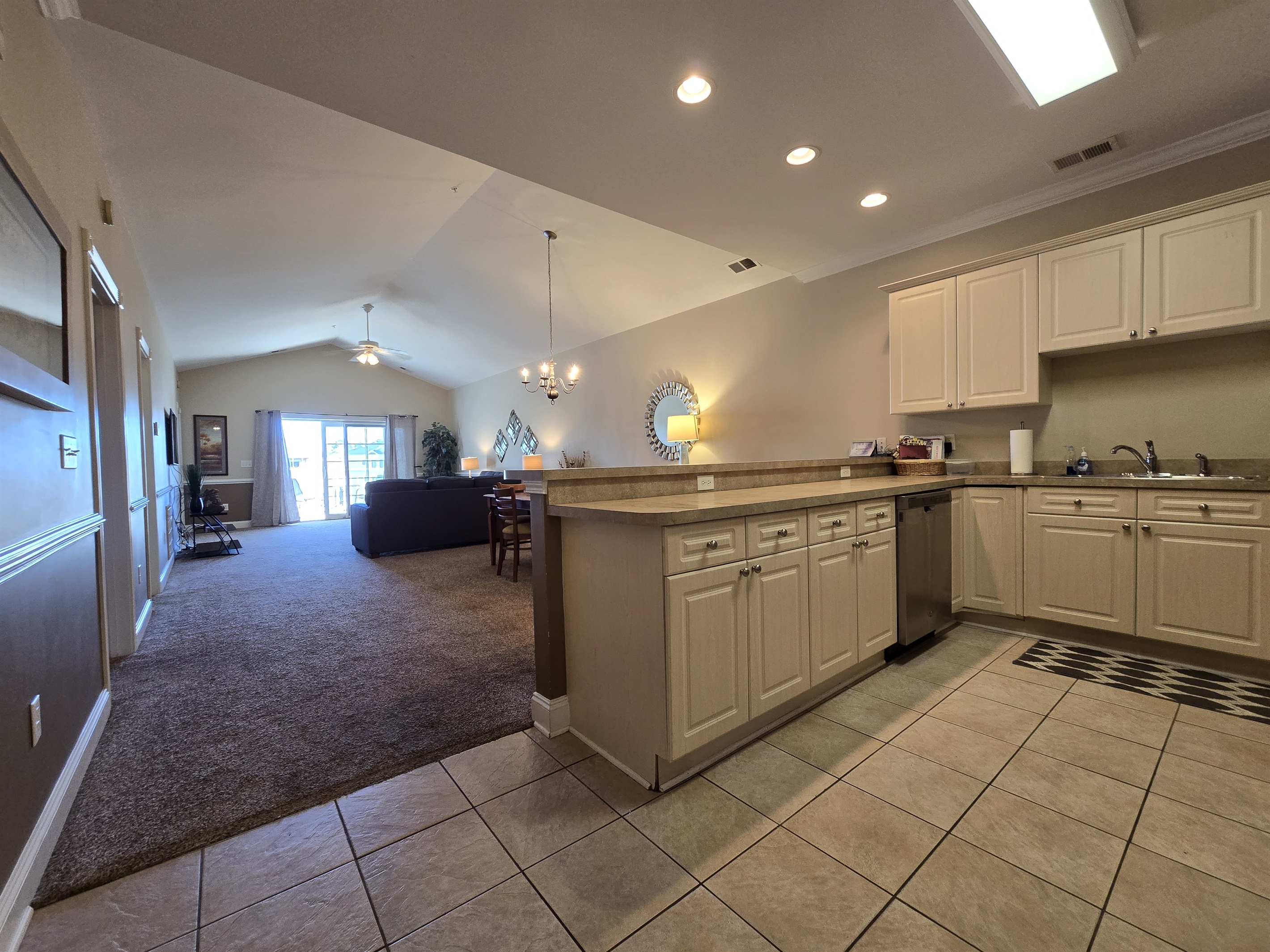 Full Kitchen with Dishwasher, Freezer/Refrigerator, Stove, Microwave, Breakfast Bar.