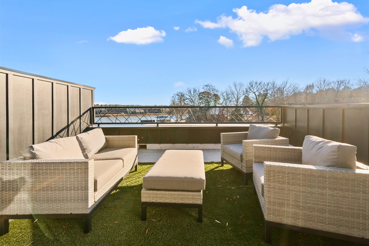 Step outside to this inviting seating area, where you can sip your morning coffee, enjoy a good book, or watch the sunset with stunning lake views as your backdrop.