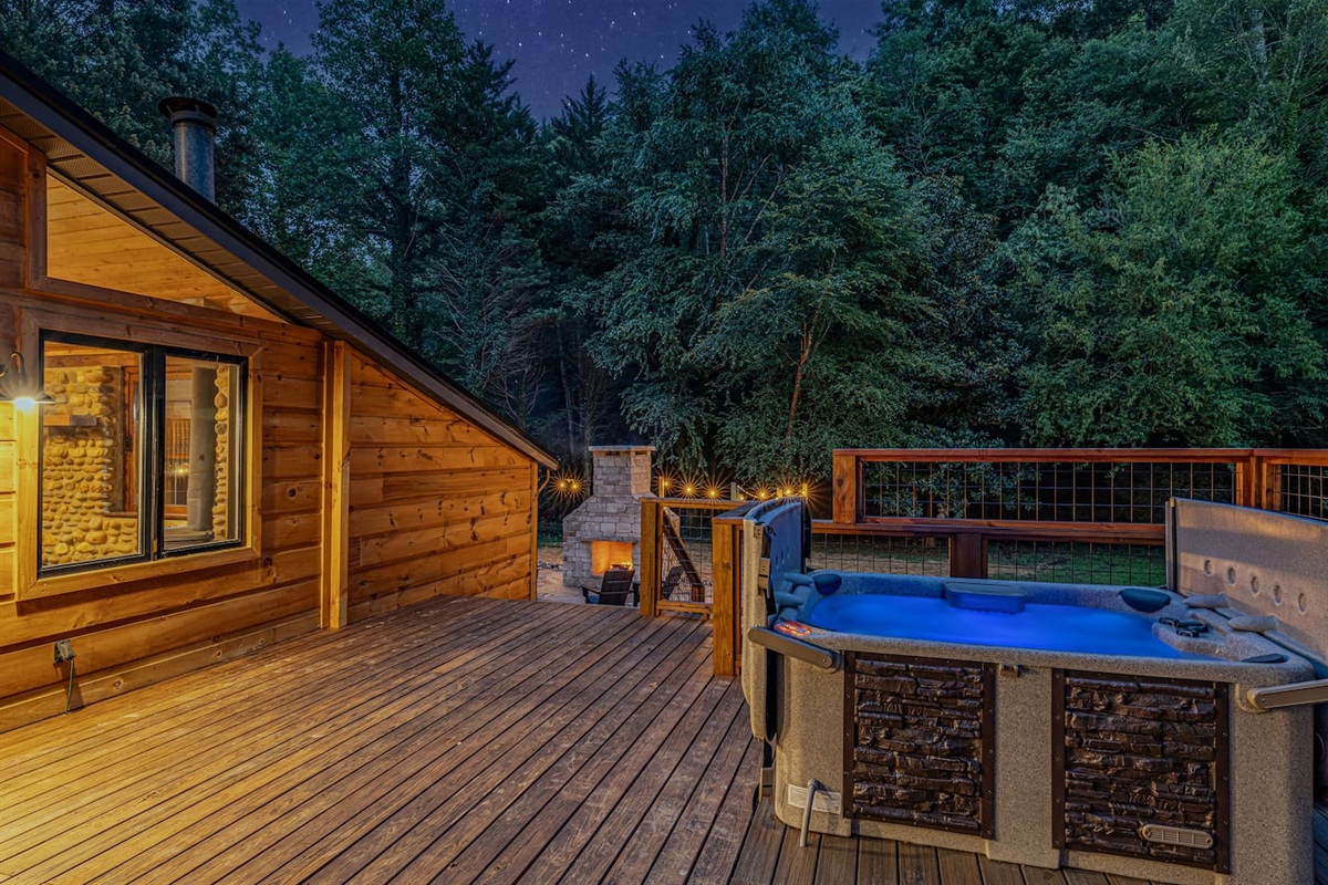 Soak beneath a canopy of stars in the private six-person hot tub, where the surrounding forest and mountain night air create a truly tranquil escape.