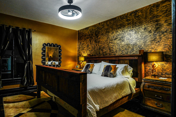 King Bedroom by night. Super comfy King bed with plenty of pillows, blankets, and blackout curtains for a great night's sleep. 