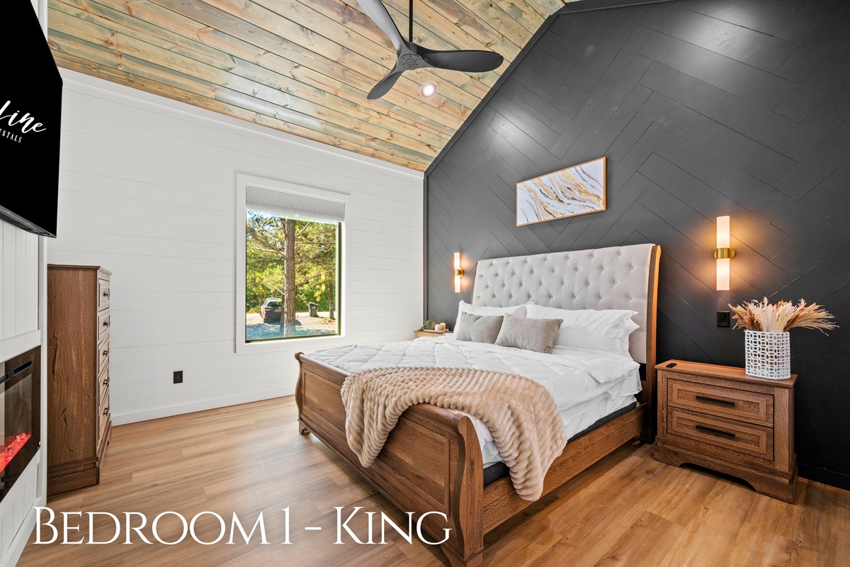 This king suite combines cozy textures, warm lighting, and peaceful surroundings for a restful night’s sleep.