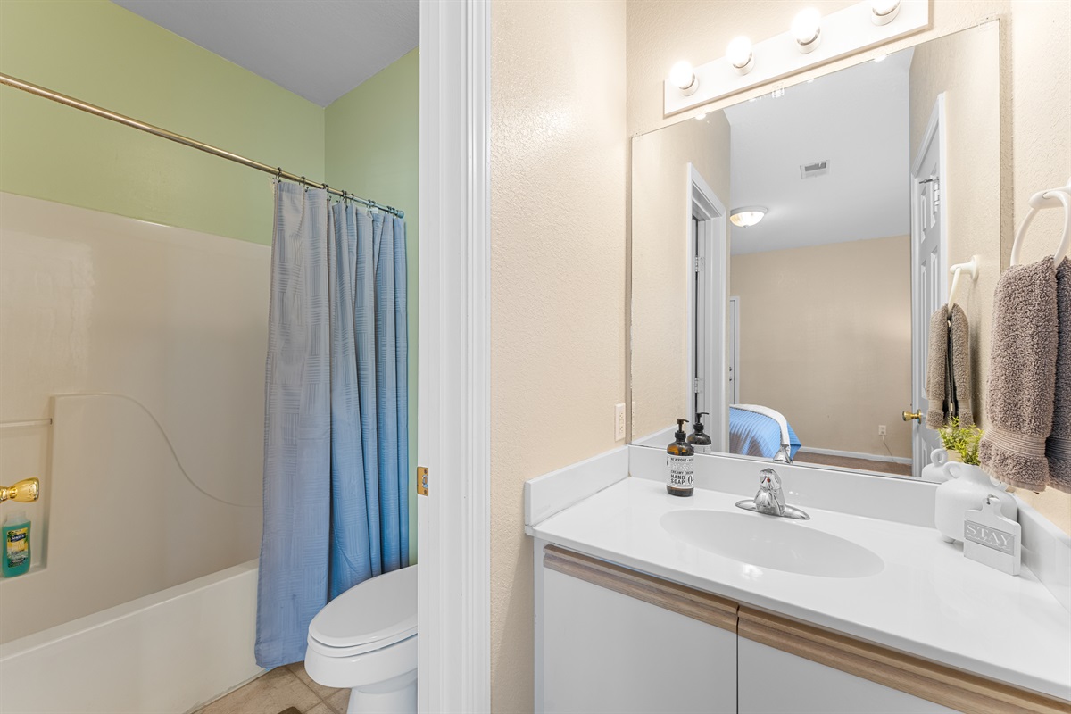 Second full bathroom with tub/shower combo—clean, simple, and convenient for guests.