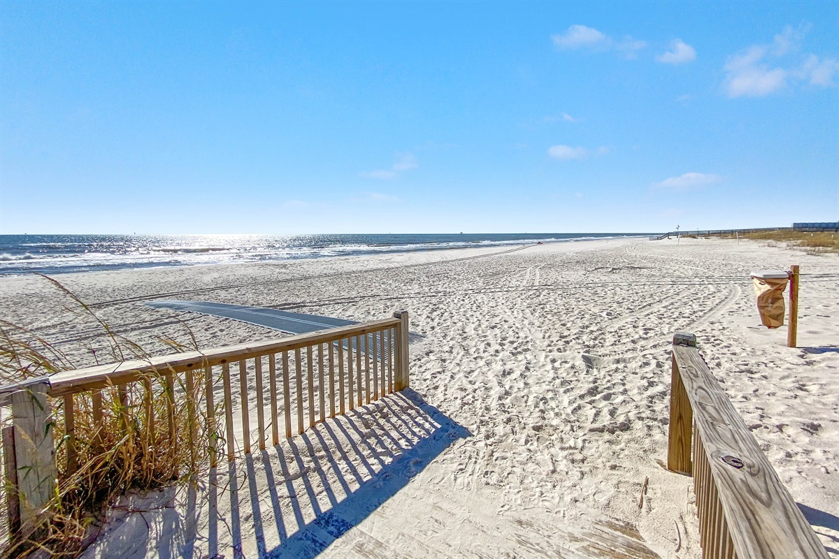 Directly on the sands, this beachfront building offers unparalleled access to the shore and stunning coastal views.