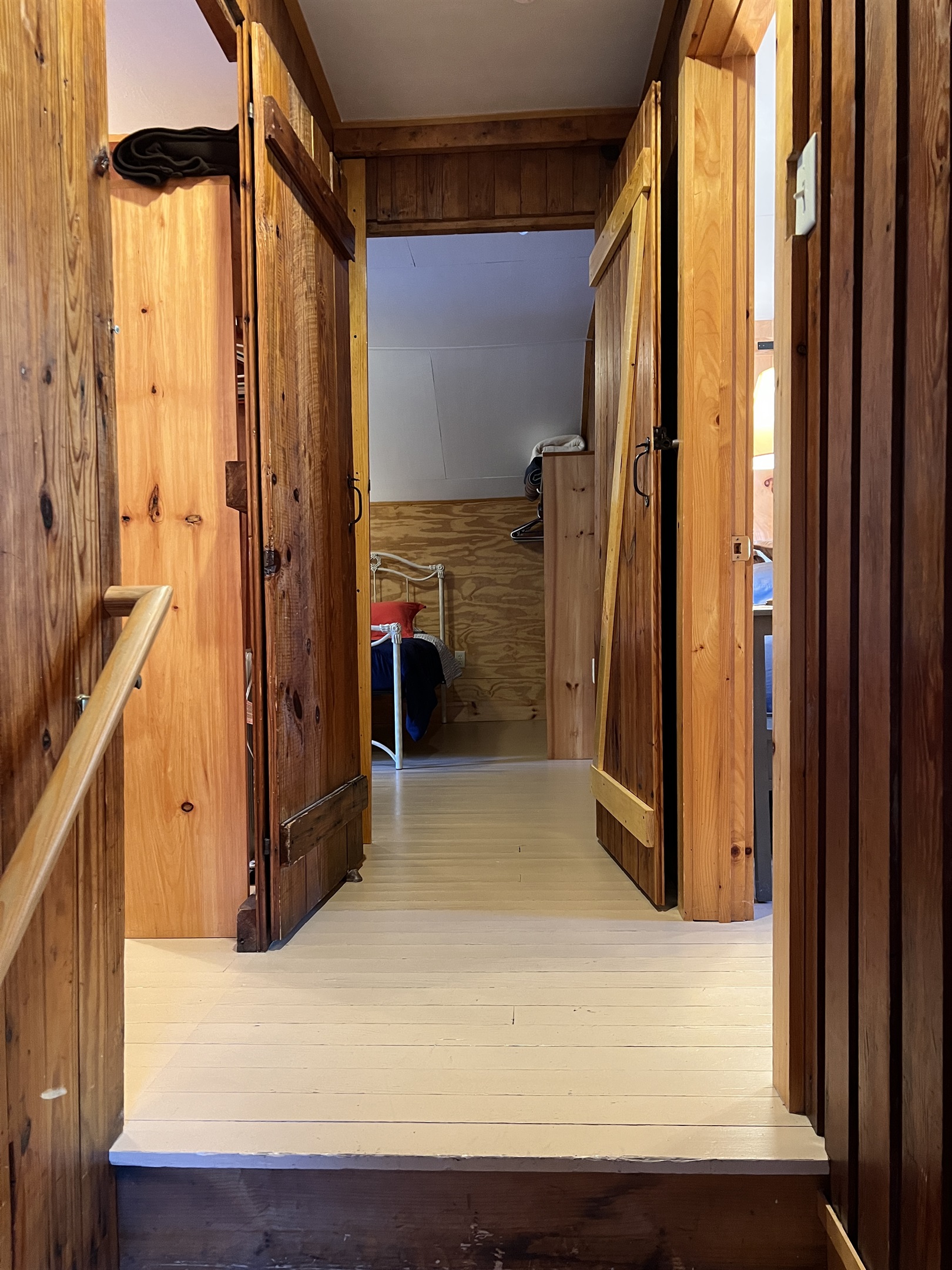 Alcove atop the stairs, entry into each bedroom. Primary to the right, kids straight ahead, queen #2 to the left.