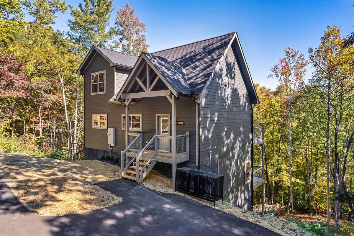 A private Smoky Mountain retreat surrounded by mature trees.