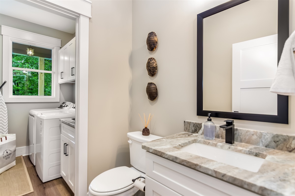 Half bathroom and laundry room connected 