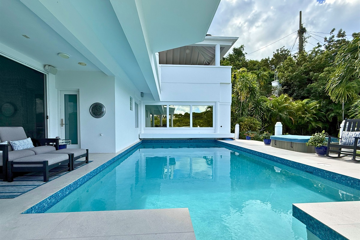 A gorgeous pool with covered and uncovered seating