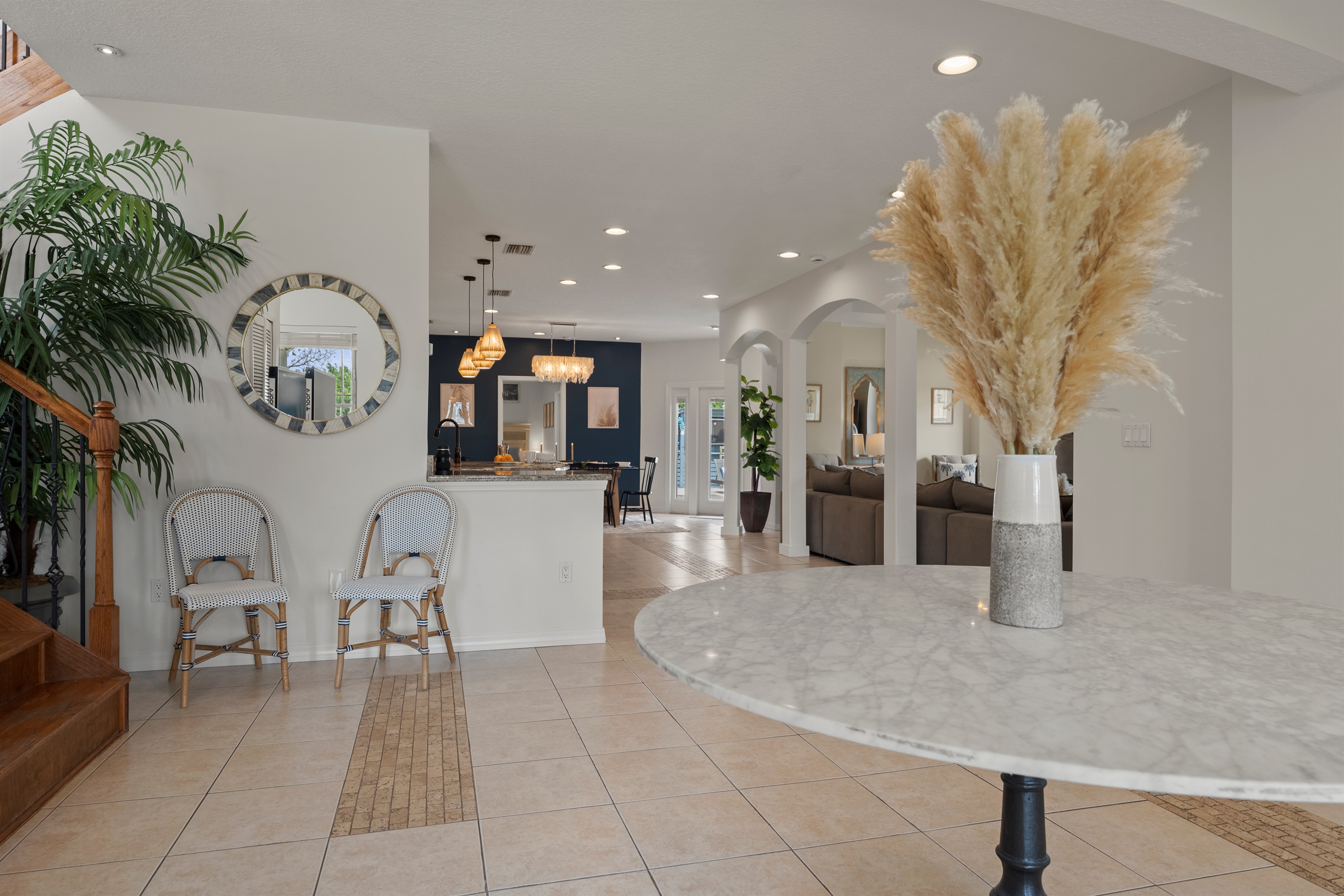 Grand, open entryway warmly invites you into the home.