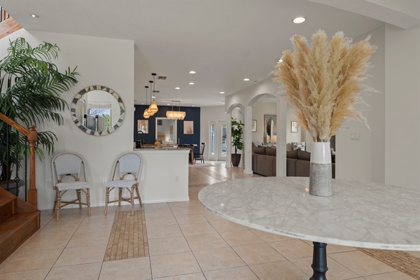 Grand, open entryway warmly invites you into the home.
