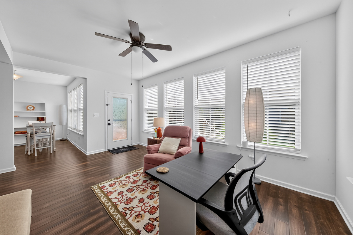 Work or relax in the bright sunroom equipped with task lighting and charging stations.