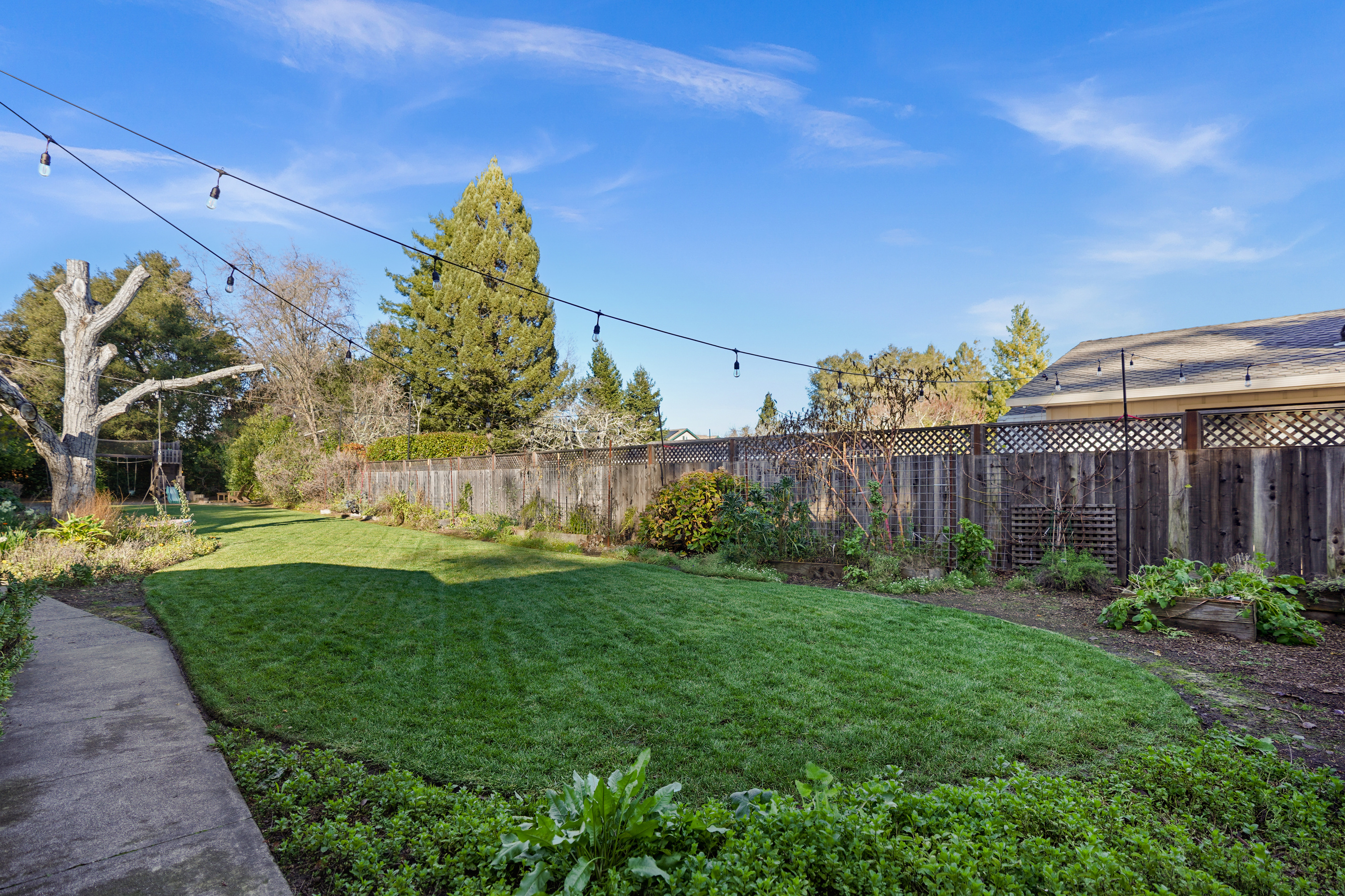 The spacious backyard offers plenty of room to relax, play, and enjoy the outdoors. Whether you're sipping your morning coffee, dining outside, or spending time with family and friends, it's the perfect place to unwind.
