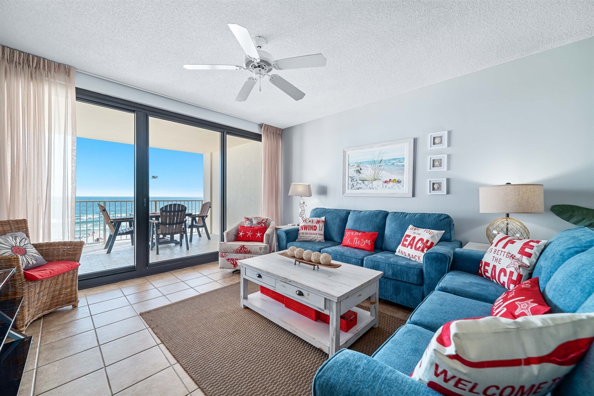 Experience the beauty of indoor-outdoor living with expansive sliding doors leading to a private balcony overlooking the ocean.