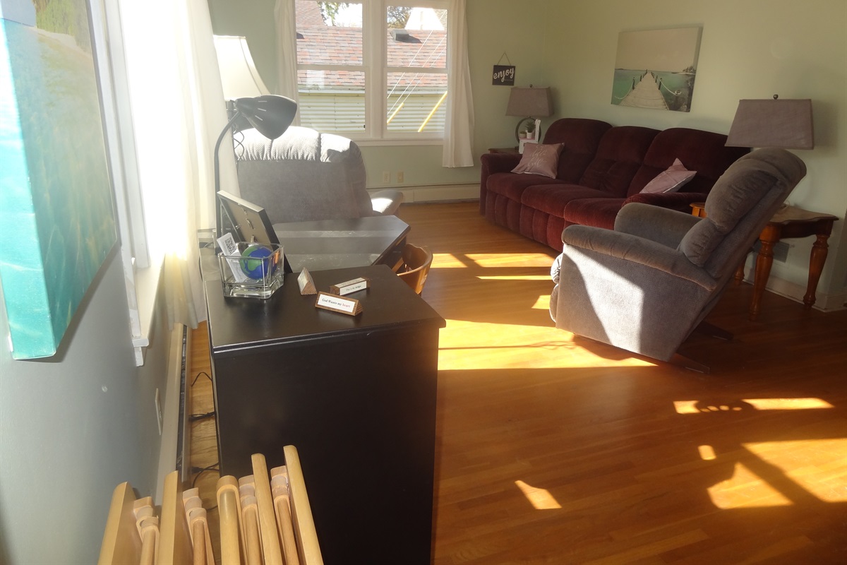 Full size couch, 2 recliners, Roku smart TV, laptop work space