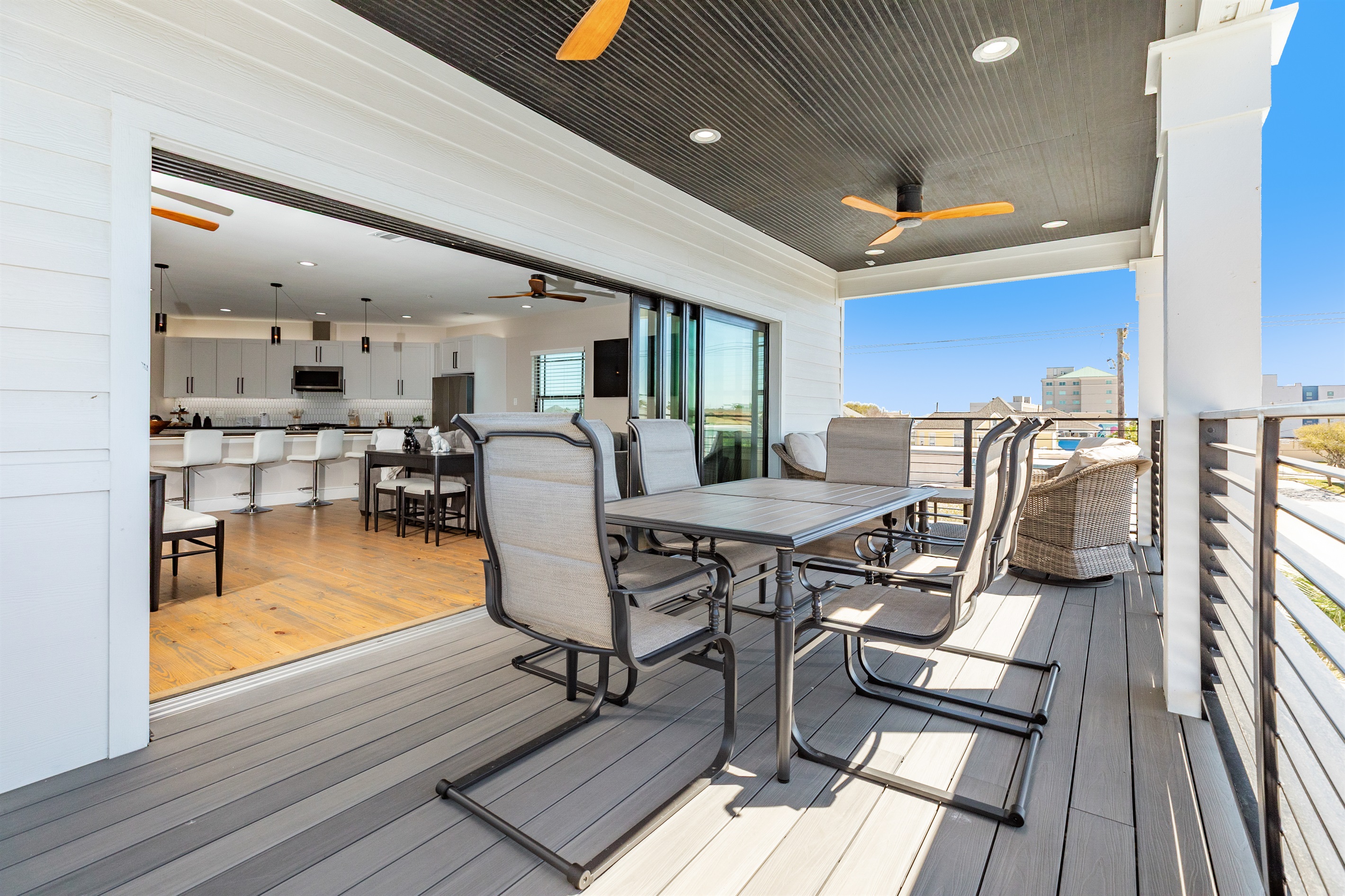 Dining Terrace: Enjoy alfresco meals with ocean views and gentle breezes on this spacious deck that opens up fully to the space inside!