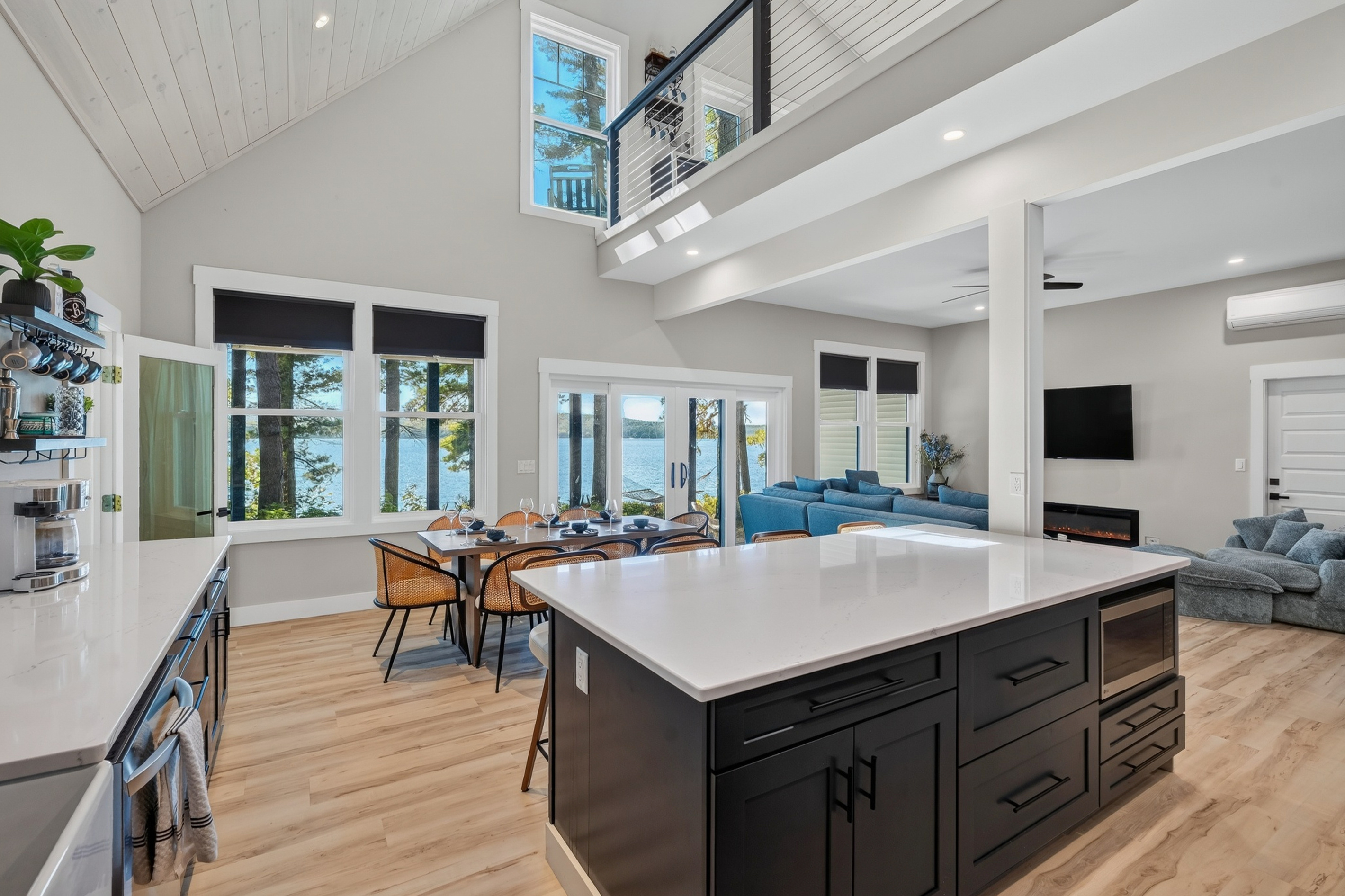 Walk in, spot the lake through those soaring windows, and immediately know you chose the right house.