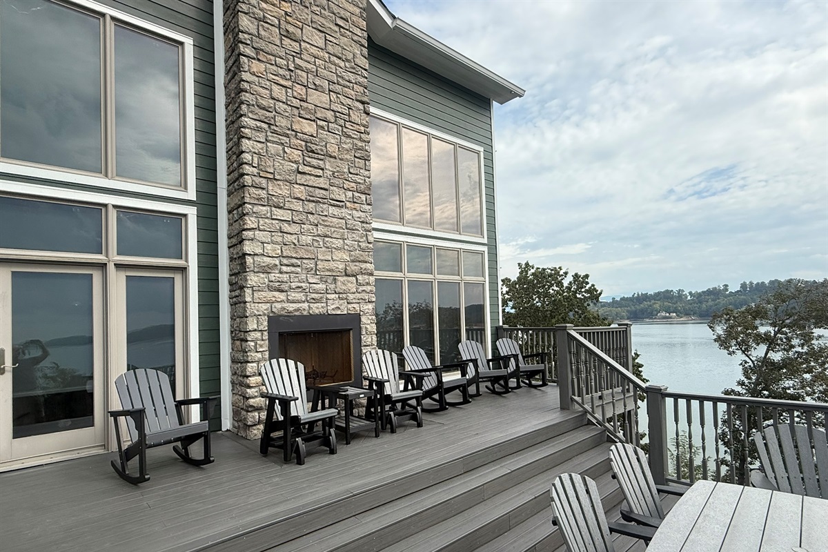 Back deck overlooking Douglas lake; 2-story windows in living room