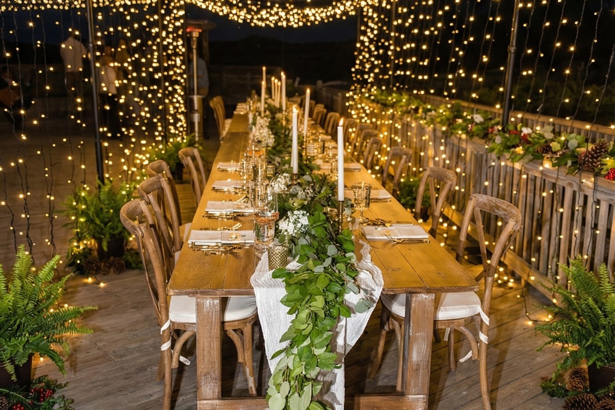 The spacious deck accommodates elaborate dining setups including patio heaters, ensuring guest comfort for evening events or cooler coastal nights.