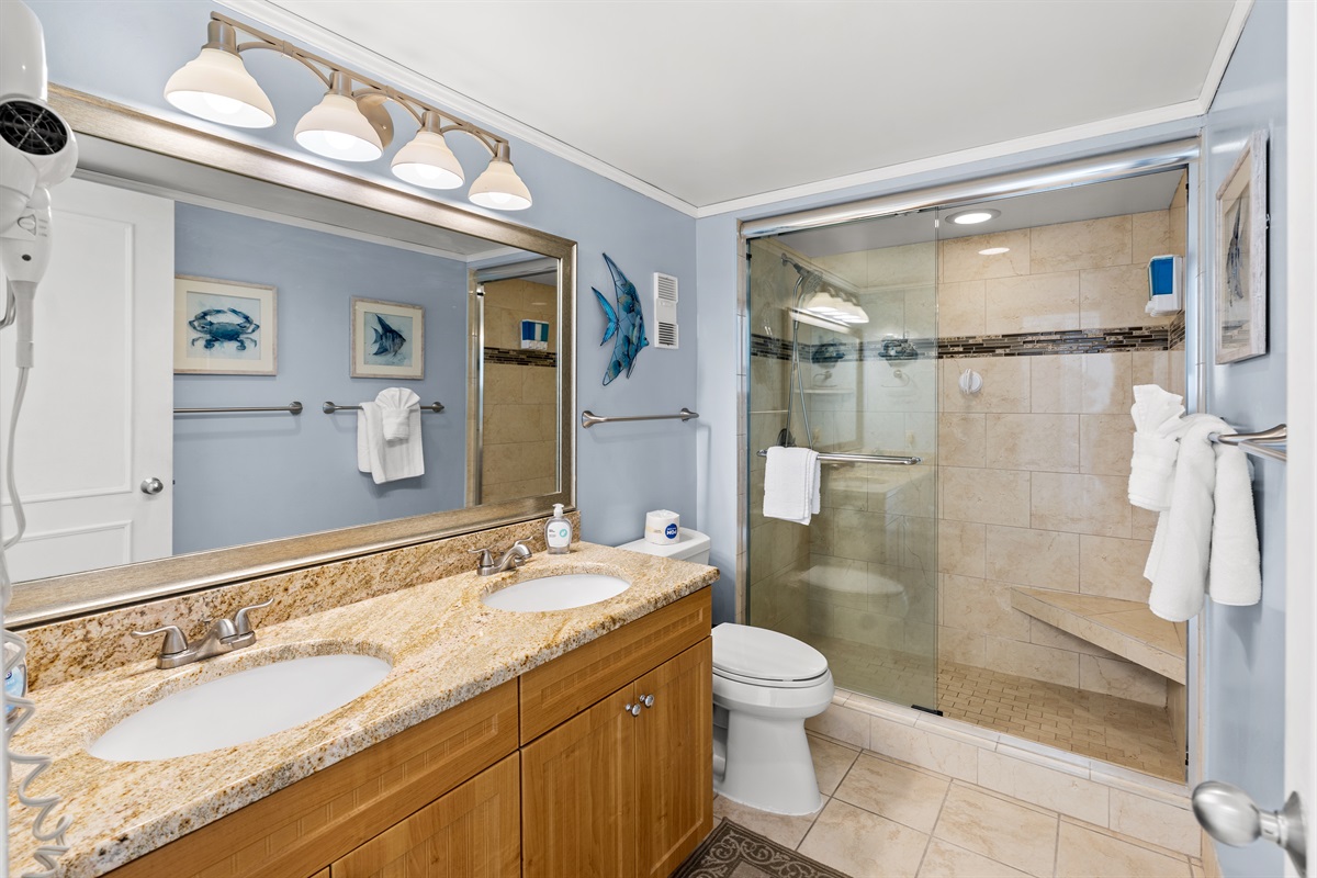 Main bath with double sinks and stand alone shower