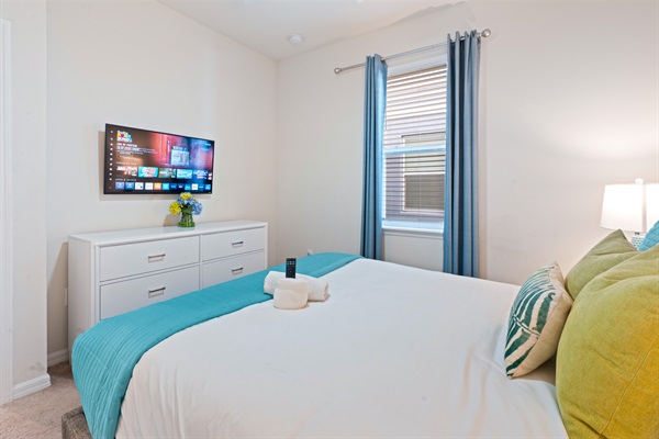 The Mojito Ensuite Room, located on the main floor, offers a serene escape with a comfortable queen bed, private bathroom, and a TV for laid-back evenings.