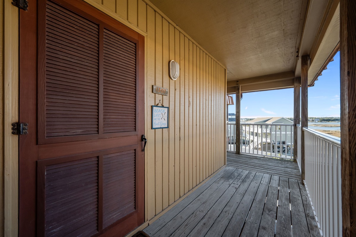 Your private, covered entry welcomes you in with coastal charm and an easy arrival after a day by the shore