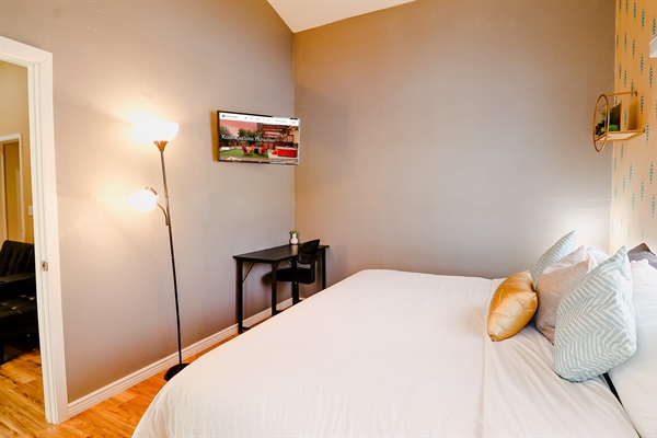 A bedroom centered around a soft bed, offering a plush and inviting sleep experience that envelops you in ultimate comfort and relaxation.
