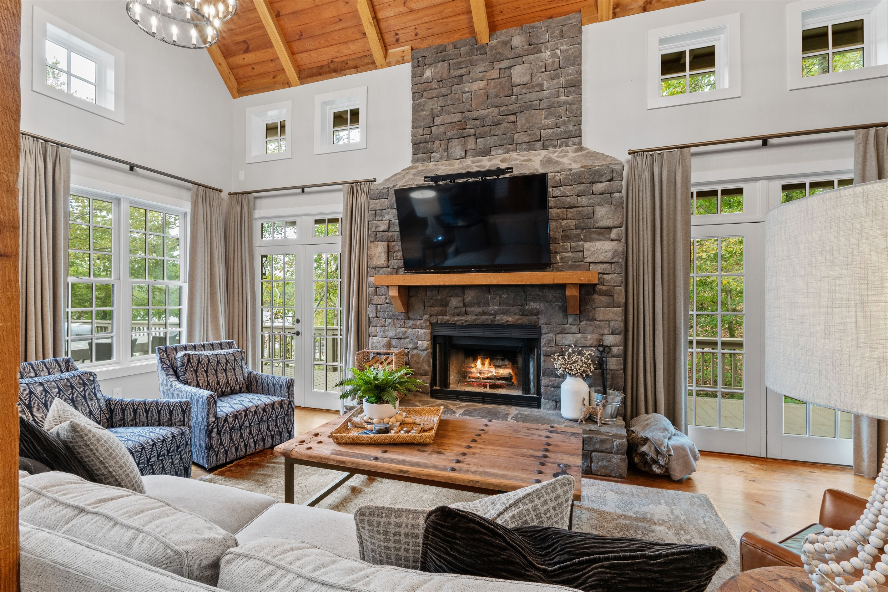 Cozy up in the living area with a wood-burning fireplace, perfect for relaxing after a day on the lake or enjoying cool evenings by the fire.