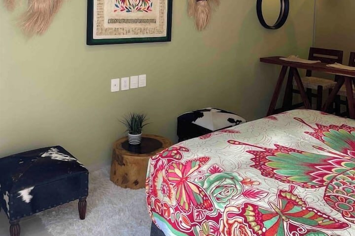 local art pieces and furniture are displayed in the room. 322