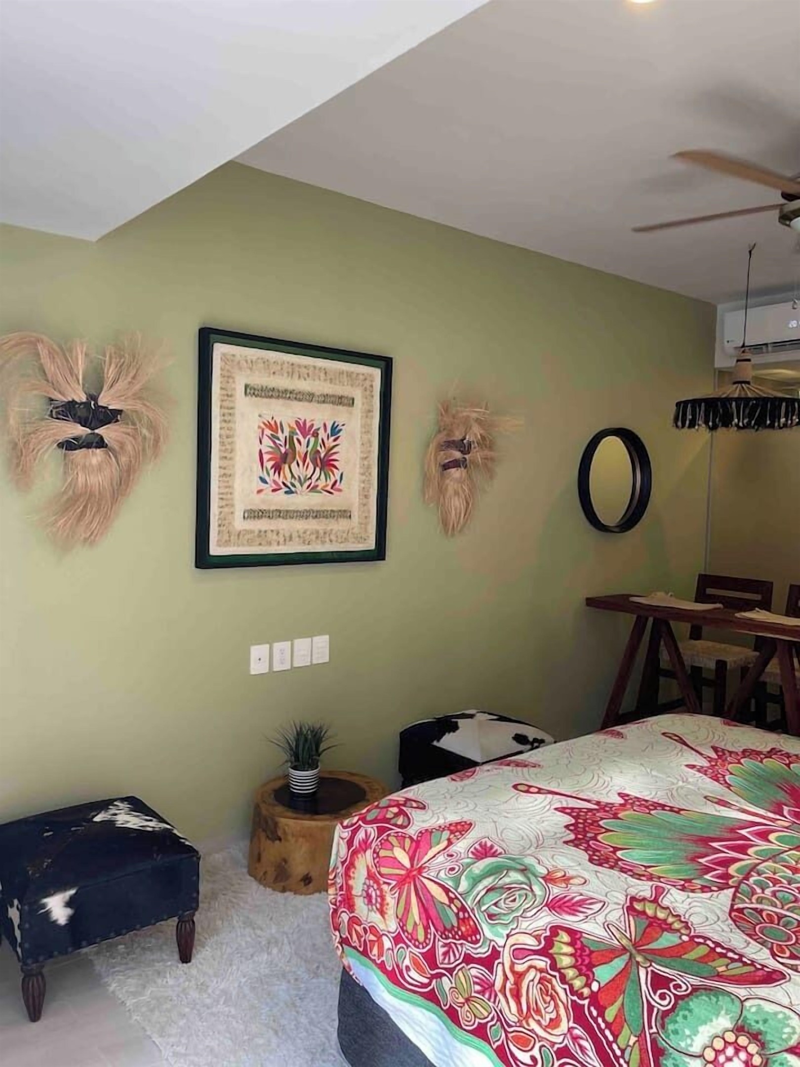 local art pieces and furniture are displayed in the room. 322