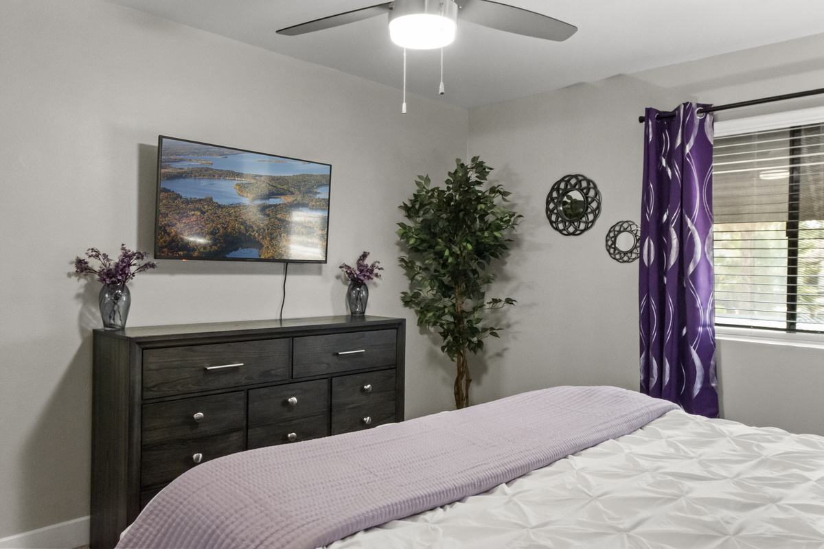 Relax and recharge in this cozy bedroom with comfortable bedding and a peaceful atmosphere with TV access