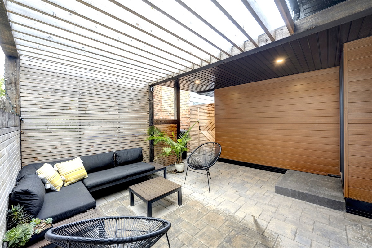 Covered pergola patio offering a quiet outdoor space to relax.