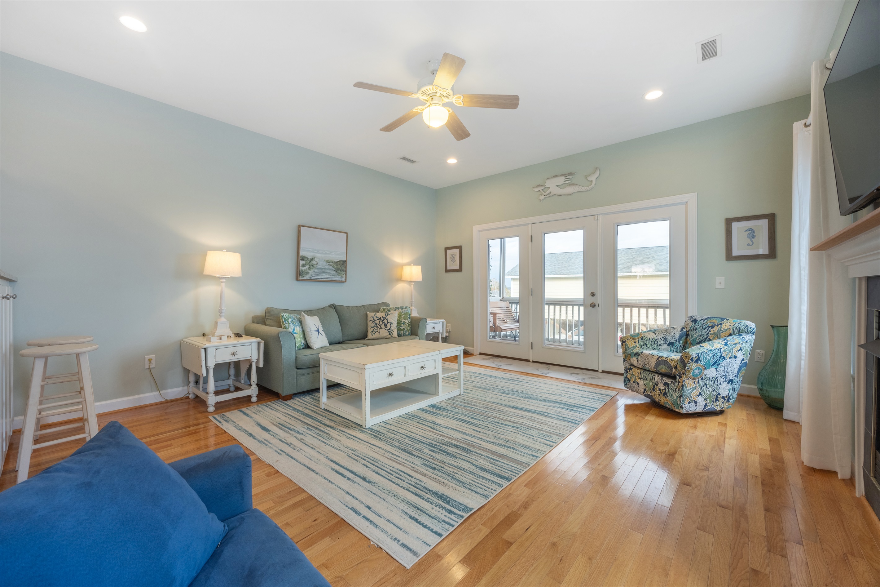 Spacious coastal living room filled with natural light